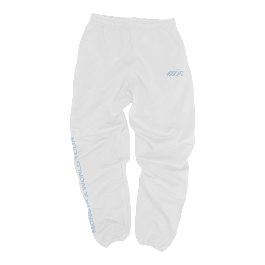 White sweatpants with a light blue MX logo on the left thigh and vertical light blue text reading 'MONSTA X WORLD TOUR' down the right leg.