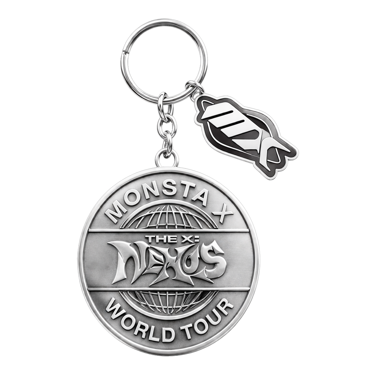 A silver-toned metal keychain featuring a round commemorative medallion with 'MONSTA THE X-NEXUS WORLD TOUR' text and a small dangling MX-shaped charm, shown on a plain white background.