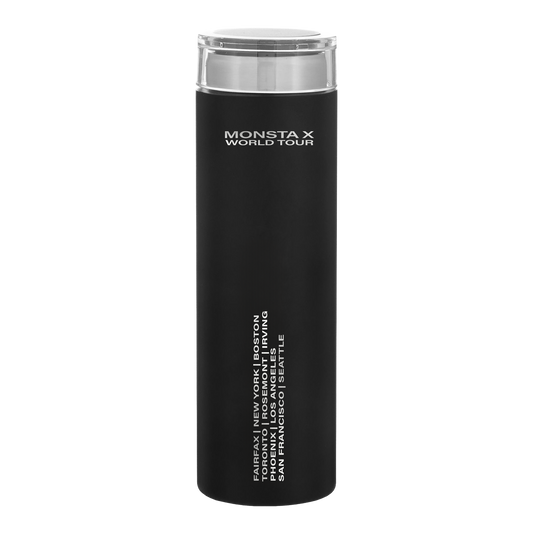 A black insulated travel tumbler with a clear lid, featuring white text that reads 'MONSTA X WORLD TOUR' and additional city names along the lower side, shown on a plain white background.
